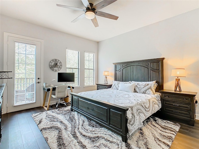 bedroom featuring access to outside, multiple windows, ceiling fan, and dark hardwood / wood-style flooring