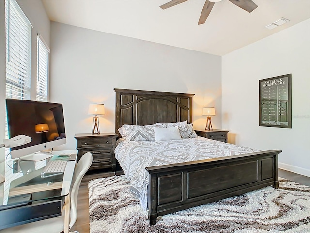 bedroom with ceiling fan and wood-type flooring