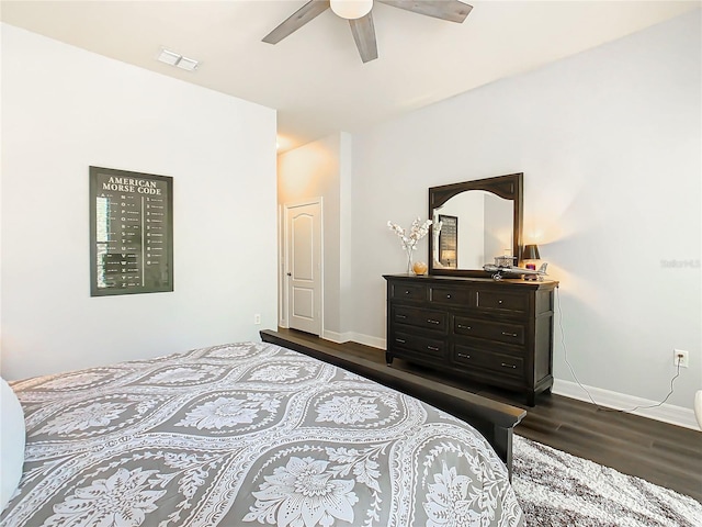 bedroom featuring ceiling fan and dark wood-type flooring