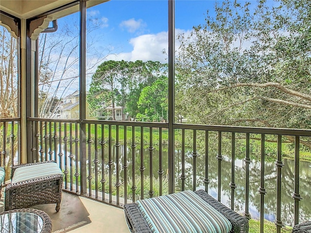 sunroom with a water view