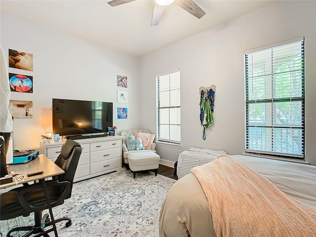 bedroom featuring hardwood / wood-style flooring and ceiling fan