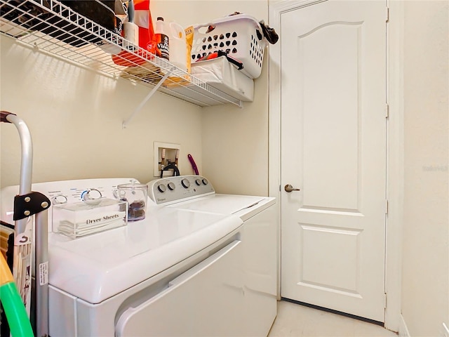 laundry room with washing machine and clothes dryer