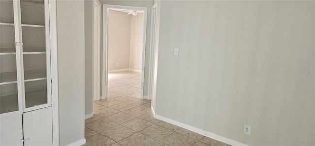 hall featuring light tile patterned floors