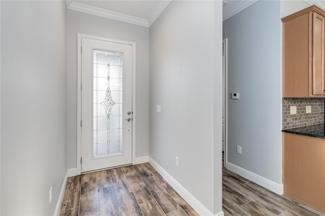 foyer featuring dark hardwood / wood-style flooring and ornamental molding