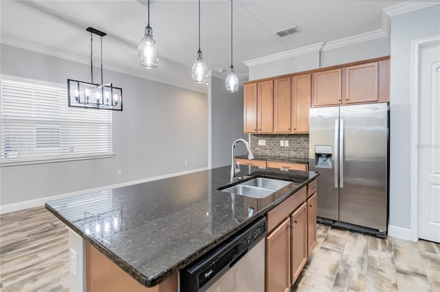 kitchen featuring a center island with sink, hanging light fixtures, and appliances with stainless steel finishes