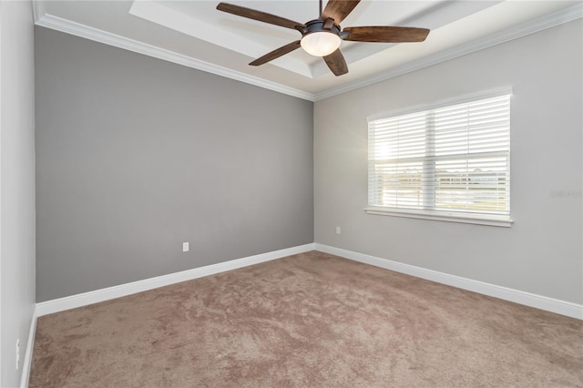 unfurnished room featuring ceiling fan, light colored carpet, and ornamental molding