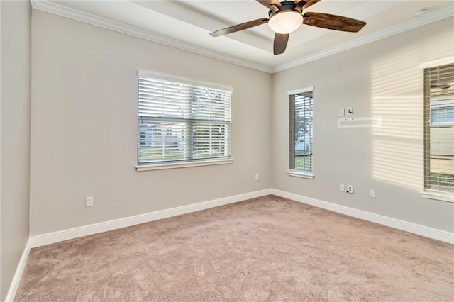 empty room featuring ceiling fan, light colored carpet, and ornamental molding