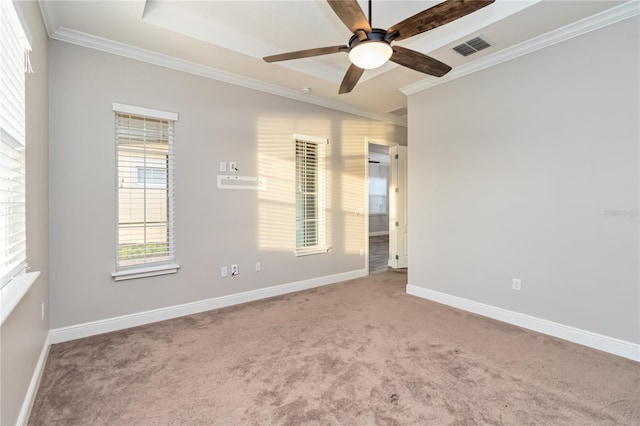 carpeted empty room featuring ceiling fan and ornamental molding