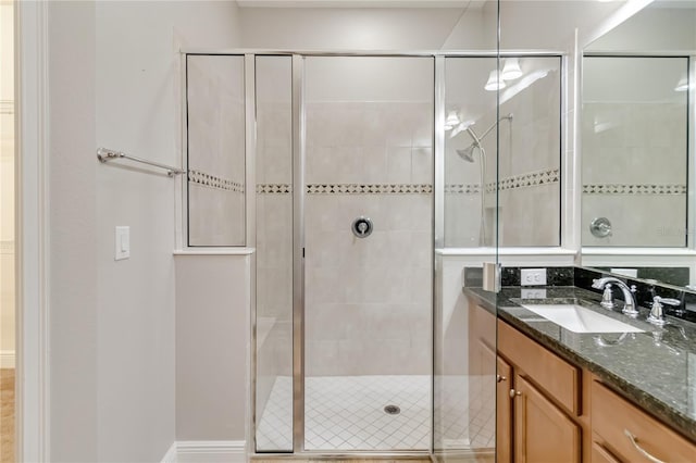 bathroom with vanity and an enclosed shower