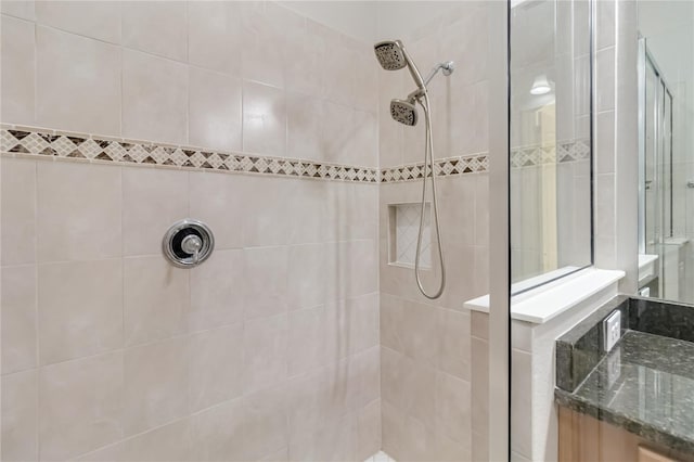 bathroom with a tile shower