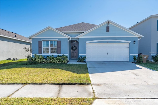 ranch-style house with a garage and a front yard