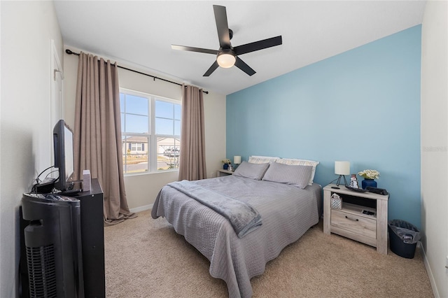 bedroom with ceiling fan and light colored carpet