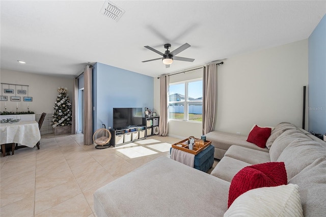 living room with light tile patterned floors and ceiling fan