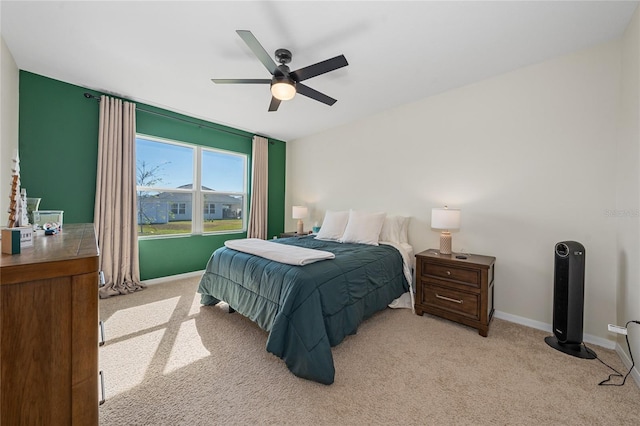 bedroom with ceiling fan and light colored carpet