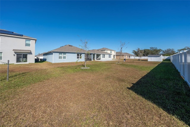 rear view of property with a lawn