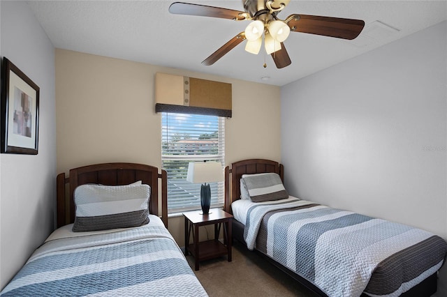 bedroom with ceiling fan and carpet floors