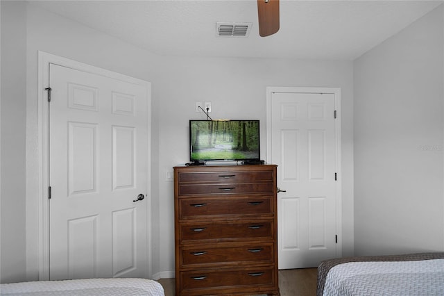 bedroom featuring a textured ceiling and ceiling fan