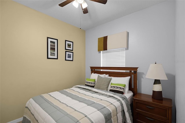 bedroom featuring a textured ceiling and ceiling fan