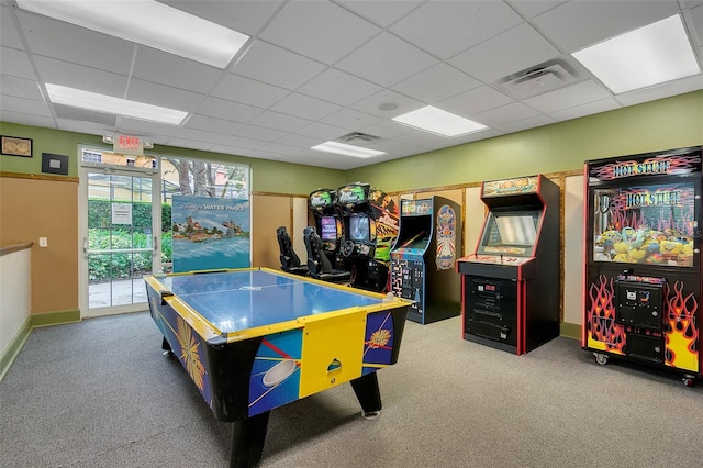 recreation room featuring a paneled ceiling and carpet floors