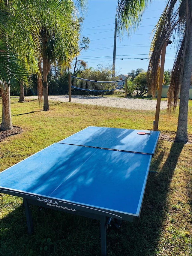 exterior space featuring volleyball court and a lawn