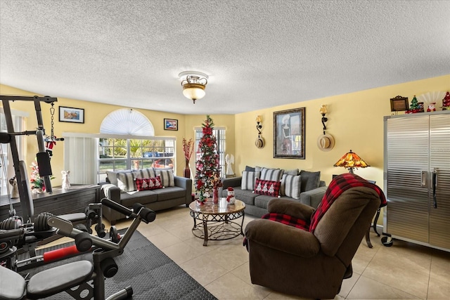 living room with light tile patterned floors and a textured ceiling