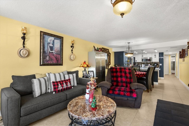 tiled living room featuring a textured ceiling