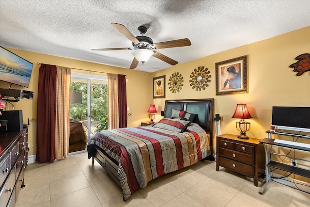 tiled bedroom with ceiling fan, a textured ceiling, and access to outside