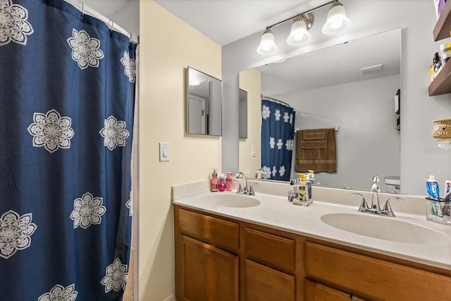 bathroom with vanity and curtained shower