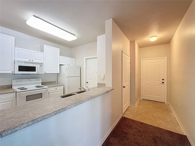 kitchen featuring white cabinetry, white appliances, sink, and light tile patterned floors