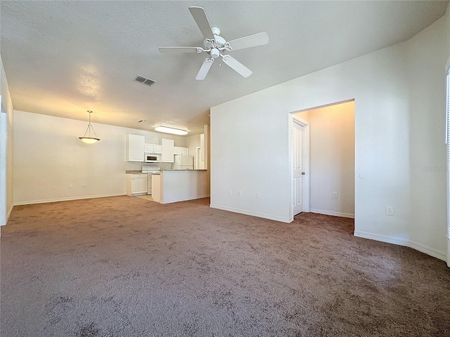 unfurnished living room with carpet floors and ceiling fan