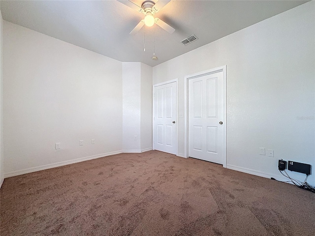 unfurnished bedroom featuring carpet and ceiling fan