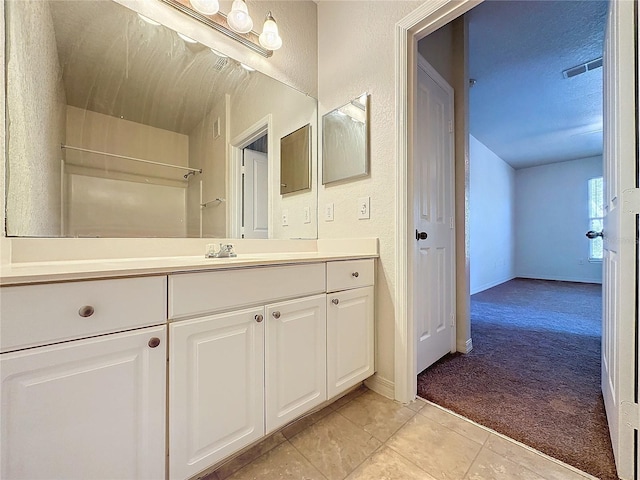 bathroom featuring tile patterned floors and vanity