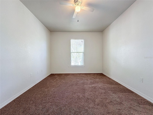 spare room with ceiling fan and carpet floors