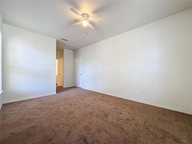 spare room with carpet flooring and ceiling fan