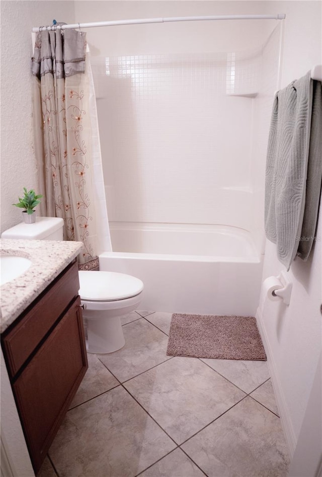 full bathroom with tile patterned floors, vanity, toilet, and shower / tub combo with curtain