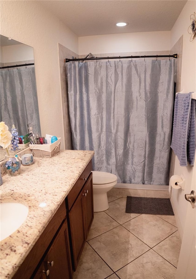 326 Dinner Lake Ct, Lake Wales, FL 33859 - full bath featuring vanity, toilet, tile patterned flooring, and a shower with curtain