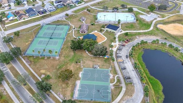 birds eye view of property with a water view