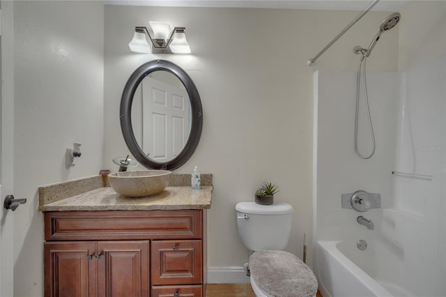 full bathroom featuring shower / bathtub combination, vanity, and toilet