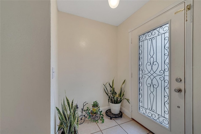 entryway with light tile patterned floors