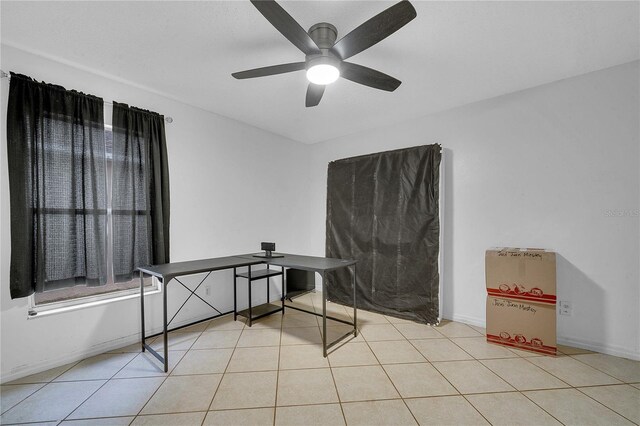 miscellaneous room featuring light tile patterned flooring and ceiling fan