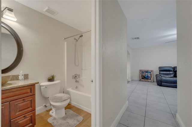 full bathroom with vanity, bathtub / shower combination, and toilet