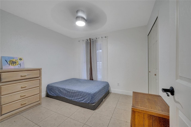 bedroom featuring light tile patterned floors and ceiling fan