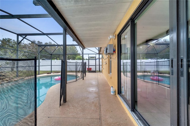 view of pool featuring a lanai and a patio