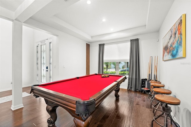 playroom with dark hardwood / wood-style floors, a raised ceiling, and pool table