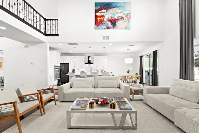 living room featuring a high ceiling