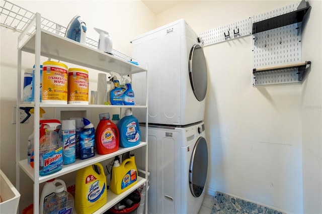 laundry room with stacked washer / drying machine