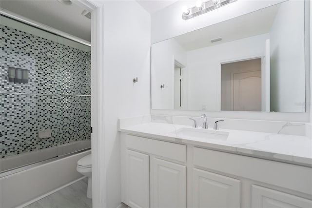 full bathroom featuring vanity, toilet, enclosed tub / shower combo, and wood-type flooring