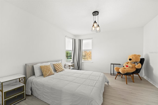 bedroom with light hardwood / wood-style floors