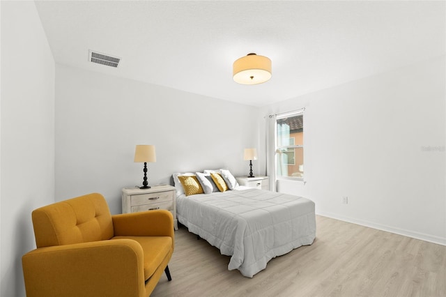 bedroom with light wood-type flooring