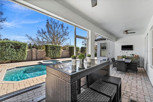 exterior space featuring ceiling fan